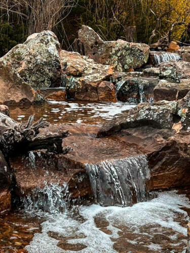 waterfall with mossy boulders