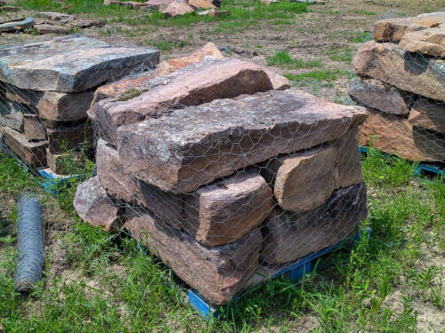 palletized red building stone